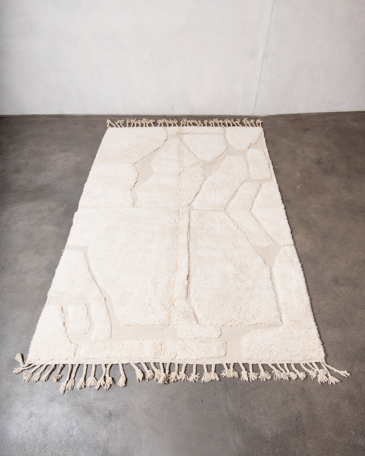 Modern, designer, handcrafted Berber rug from Morocco. Beniourain carpet with minimalist design, natural wool pile and a fluffy texture.